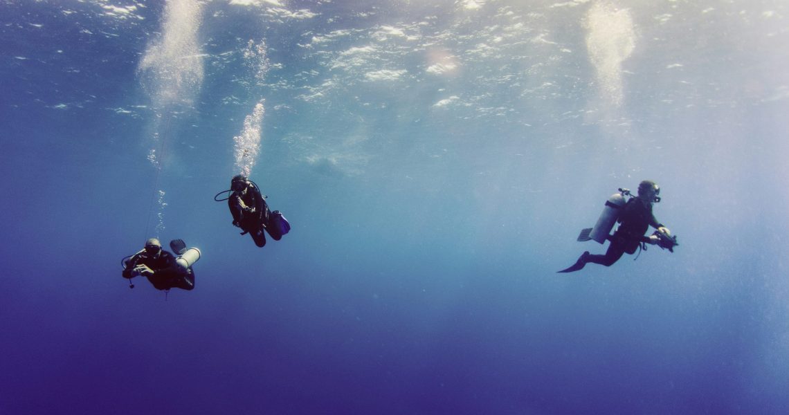 Three divers in Byron Bay